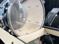 drum resting on shelves
