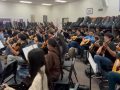 guitar ensemble classroom full of students and instruments