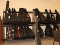 guitar cases resting on shelves