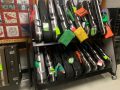 violin case rack next to bulletin board